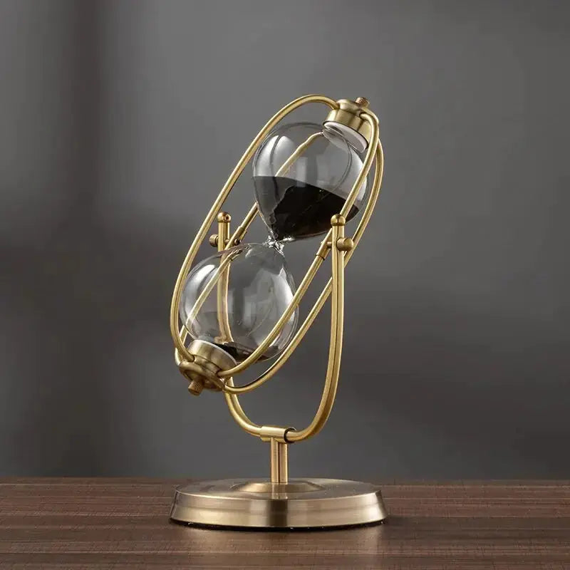 Aurelius Hourglass Timer by Zendrop with black sand flowing in its 360° rotating brass structure, perfect for home decor.