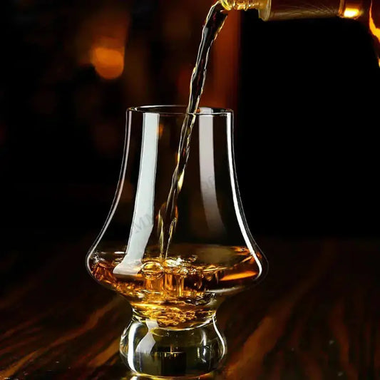 A crystal tasting glass from Zendrop being filled with whiskey, showcasing its elegant design and luxury for an enhanced drinking experience.