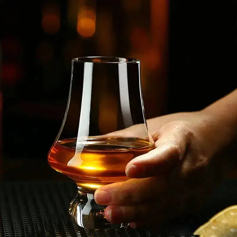 Crystal Tasting Glasses by Zendrop showcasing an elegant glass gripped by a hand, ideal for appreciating the aromas of fine beverages.