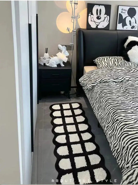 Stylish Black and White Runner Rugs for Hallways & Entryways from Zendrop, displayed elegantly near a bed, enhancing modern decor.