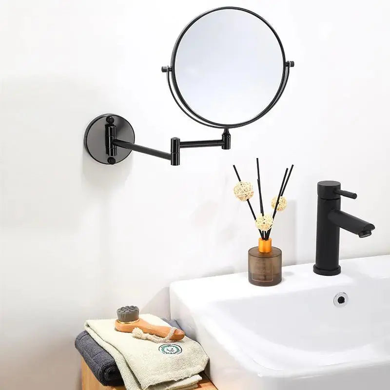 Detailed Maris Magnifying Mirror by Zendrop displayed in a bathroom setting, highlighting its functionality and stylish design, including a nearby decorative vase and sleek faucet.