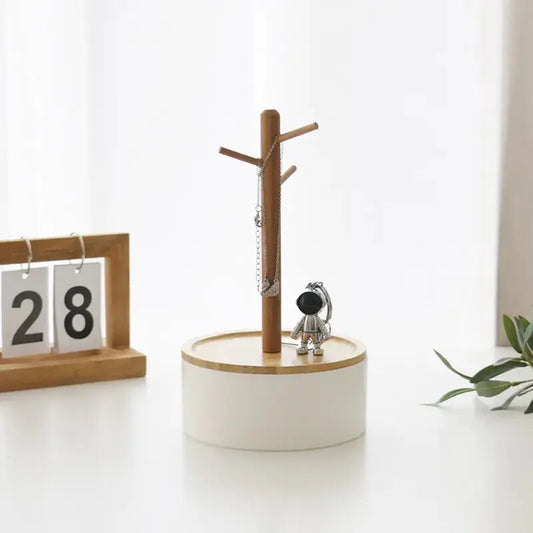 Nordic Creative Branch Storage Rack Jewelry Box by Zendrop showcasing a branch-inspired design with a jewelry organizer displaying necklaces and a decorative figurine.