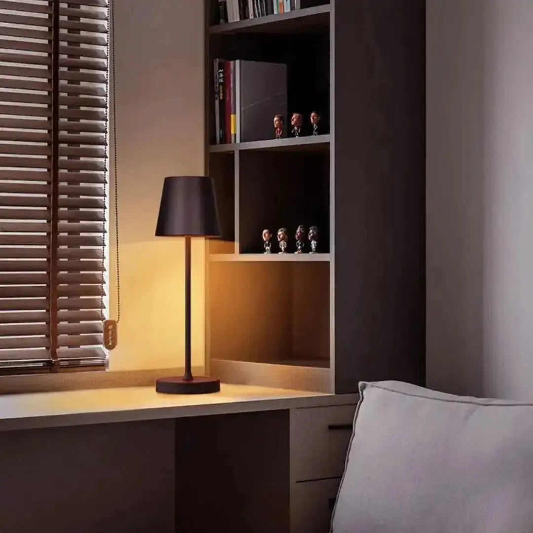 Modern cordless lamp by Zendrop placed on a desk, highlighting its sleek design and soft lighting, ideal for creating a cozy atmosphere in any indoor space.