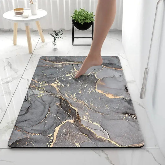 LuxeMarble Bath Rug by Zendrop with a foot stepping onto its plush surface, showcasing its marble-inspired design and gold accents, perfect for luxury bathrooms.