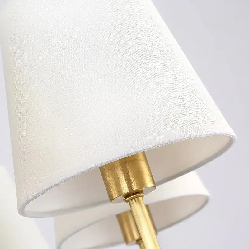 Close-up of the Classic Style Wall Light by Zendrop showcasing the textured white lampshade and golden base, highlighting its elegant design.